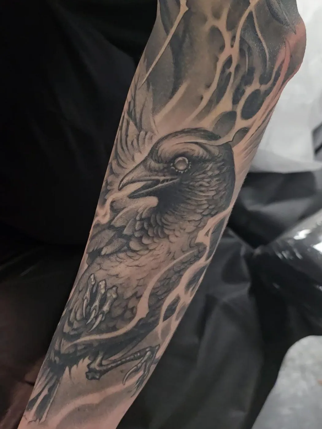 Raven forearm piece, black and grey by Gage Cheesman, Alliance Tattoo Eugene Oregon