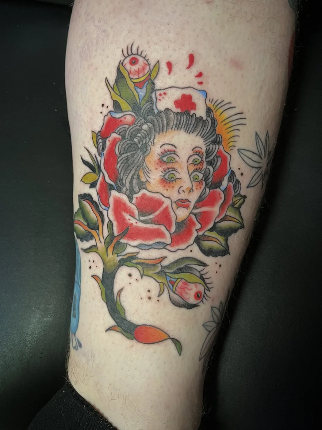 Lady head blooming from a rose branch by Ky Bell, Alliance Tattoo Eugene Oregon